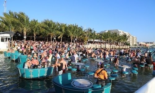 seacrets.jpg Tables in the water at Seacrets