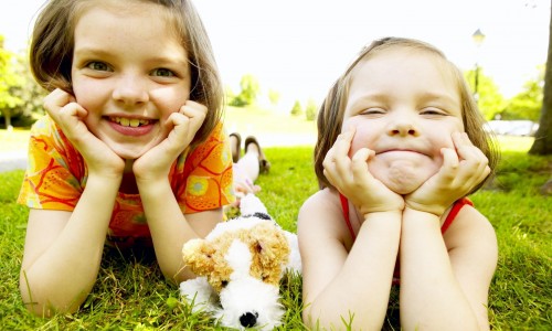 two-girls-laying-in-grass.jpg two-girls-laying-in-grass.jpg